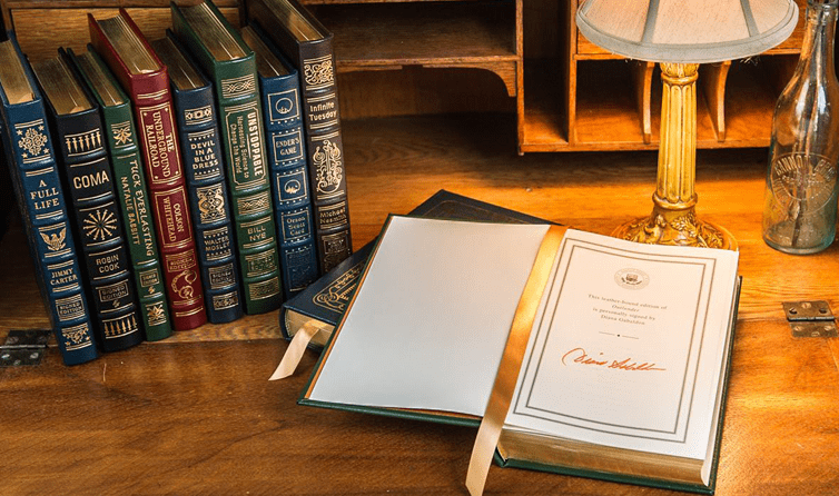 Leather-bound books in a luxurious setting